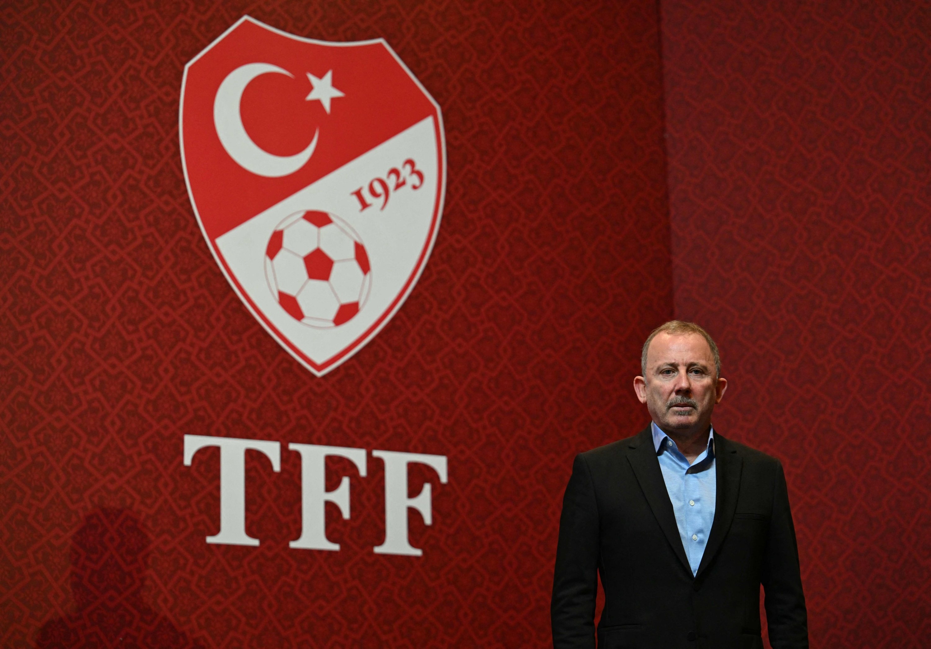 Newly appointed head coach of Türkiye's national football team, Sergen Yalçın, poses for a photo during a signing ceremony at the TFF Riva Facilities, Istanbul, Türkiye, Oct. 22, 2026. (AFP Photo)