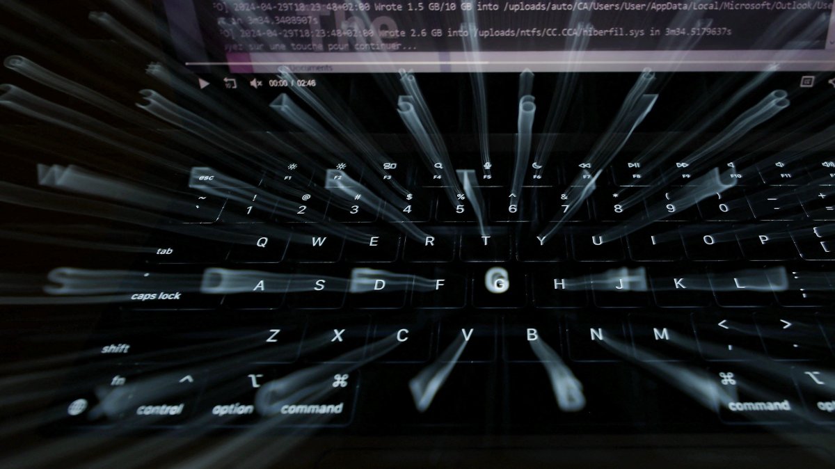 A photo illustration using a slow shutter speed shows a laptop keyboard and screen in Manchester, Britain, Oct. 22, 2026. (Reuters Photo)