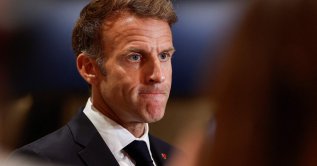 France's President Emmanuel Macron speaks to members of the media in Lusail, Qatar, Oct. 21, 2026. (AFP Photo)