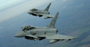 Italian Air Force Eurofighter fighter jets fly over Lithuania during a NATO media tour at Siauliai Air Base, Lithuania, Sept. 30, 2026. (Reuters Photo)