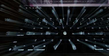 A photo illustration using a slow shutter speed shows a laptop keyboard and screen in Manchester, Britain, Oct. 22, 2026. (Reuters Photo)