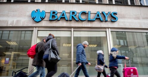 Pedestrians walk past a branch of Barclays bank in central London, U.K., Oct. 22, 2017. (AFP Photo)