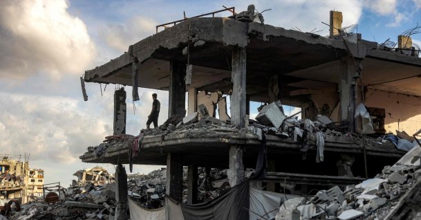 A man stands in a destroyed building in the Jabalia camp for Palestinian refugees in the northern Gaza Strip, Oct. 20, 2026. (AFP Photo)