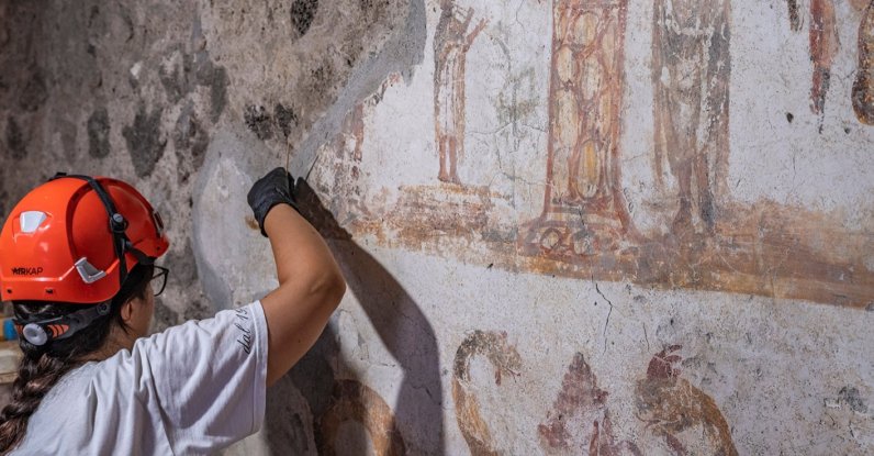 In this undated handout photo provided by the Pompeii Archaeological Park, restorers work inside the House of Marcus Fabius Rufus in Pompeii, near Naples, Italy. (AP Photo)