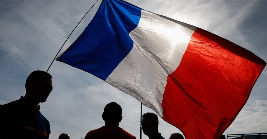 Demonstrators with the national flag in Place de Bercy in Paris, France, Sept. 28, 2026. (EPA Photo)