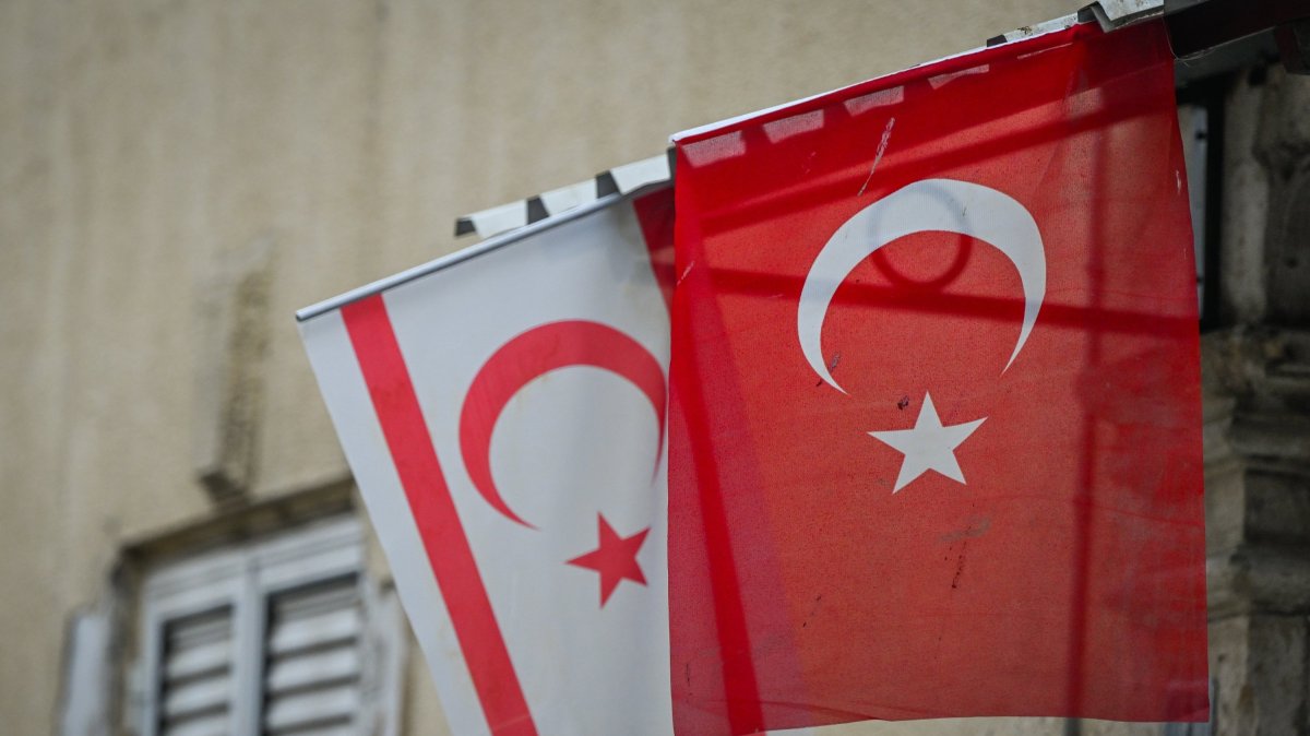 The flags of Türkiye and the Turkish Republic of Northern Cyprus (TRNC) are seen in the northern part of Nicosia, near the U.N.-controlled buffer zone, TRNC, Oct. 21, 2025. (Getty Images Photo)