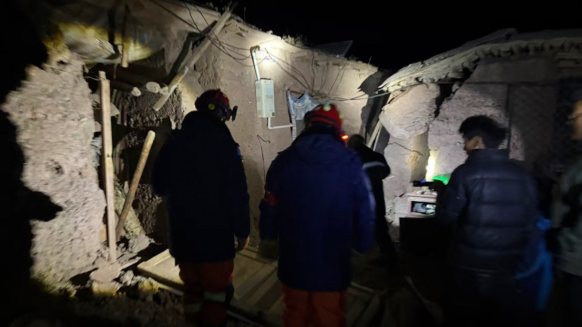 Firefighters inspect earthquake-hit village houses in Baqen County of Nagqu City, Tibet, China, Oct. 23, 2026. (AP Photo)