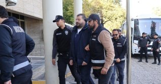 Suspects are escorted to court as part of an investigation into alleged irregularities at Milas Municipality, Muğla, southwestern Türkiye, Oct. 23, 2026. (DHA Photo)