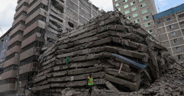 A staff from the Kenya Defence Forces Disaster Response Battalion inspects the rubble of a collapsed residential building that was still under construction in the Eastleigh neighborhood of Nairobi, Oct. 23, 2026. (AFP Photo)