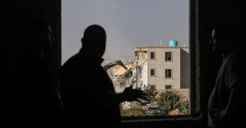 Israeli bulldozers demolish a Palestinian building in Palestinian territory occupied by Israel in the West Bank city of Hebron, Oct. 23, 2026. (AFP Photo)