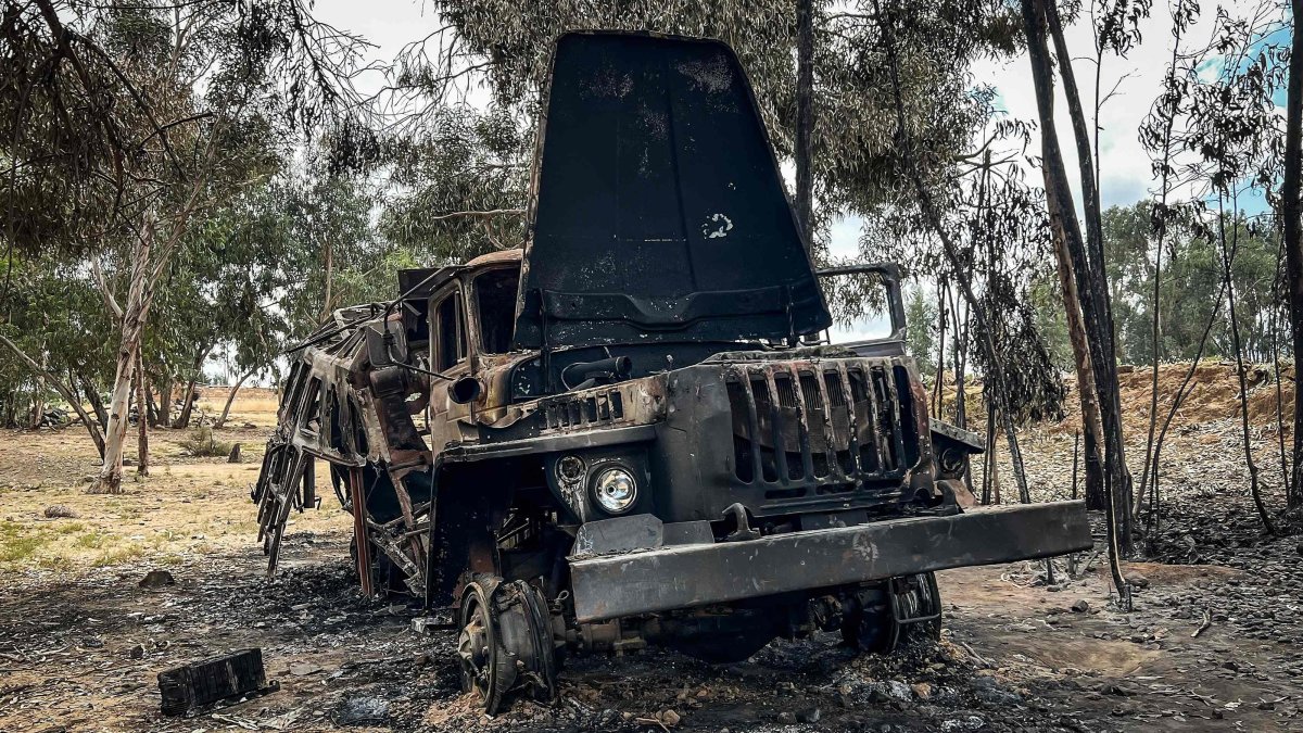 A truck belonging to the Tigray People's Liberation Front (TPLF) stands burned along a road following clashes between Ethiopian federal forces and armed groups opposed to the government, Adigrat, Ethiopia, Oct. 17, 2026. (AFP Photo)