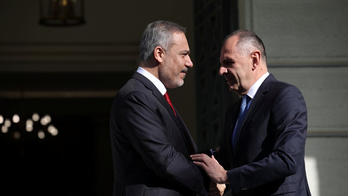 Greek Foreign Minister George Gerapetritis welcomes Turkish Foreign Minister Hakan Fidan before their talks at the Ministry of Foreign Affairs, Athens, Greece, Nov. 8, 2024. (Reuters Photo)