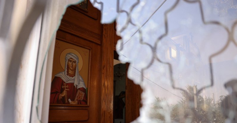 A shattered window at Saint George’s Greek Orthodox Church, where gunmen opened fire during a funeral the previous day, in the village of Hamoud, Karak, Jordan, Oct. 24, 2026. (Reuters Photo)