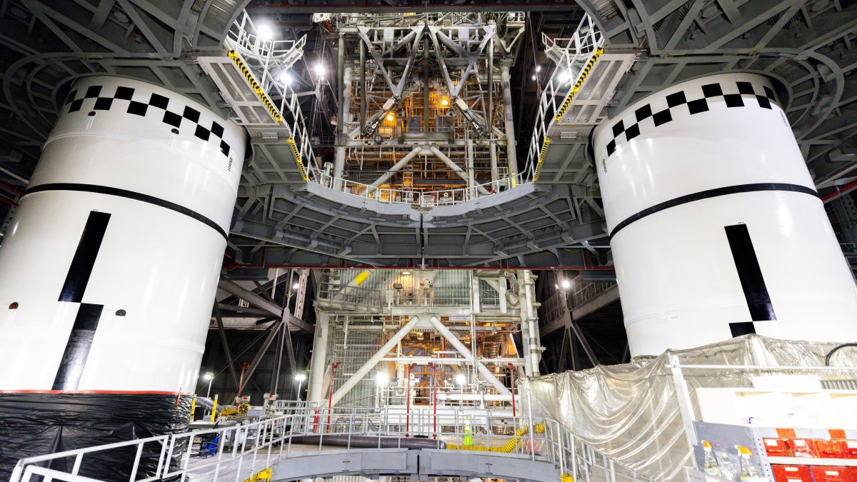 In this photo provided by NASA, the final left and right forward solid rocket booster motor segments for Artemis III are integrated onto the mobile launcher for the SLS (Space Launch System) rocket at NASA's Kennedy Space Center, Florida, U.S., Sept. 24, 2026. (AP Photo)