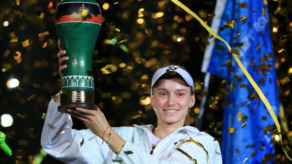 Kazakhstan's Elena Rybakina celebrates with trophy after beating Canada's Leylah Fernandez in the Ningbo Open final, in Ningbo, China, Oct. 25, 2026. (AFP Photo)