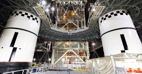 In this photo provided by NASA, the final left and right forward solid rocket booster motor segments for Artemis III are integrated onto the mobile launcher for the SLS (Space Launch System) rocket at NASA's Kennedy Space Center, Florida, U.S., Sept. 24, 2026. (AP Photo)