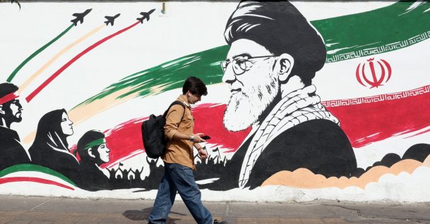 A man walks past a mural of late Iranian Supreme Leader Ayatollah Ali Khamenei on a street in Tehran, Iran, Oct. 14, 2026. (EPA Photo)