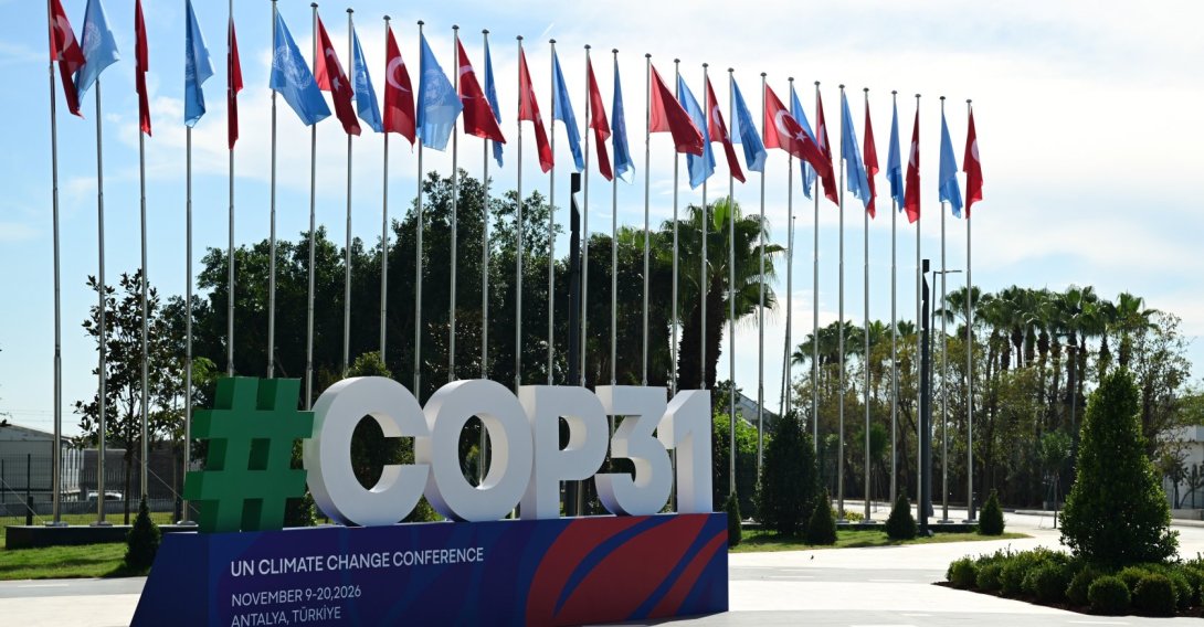 A COP31 board sign is seen in front of the venue set to host next month's U.N. climate talks, Antalya, Türkiye, Oct. 22, 2026. (AA Photo)