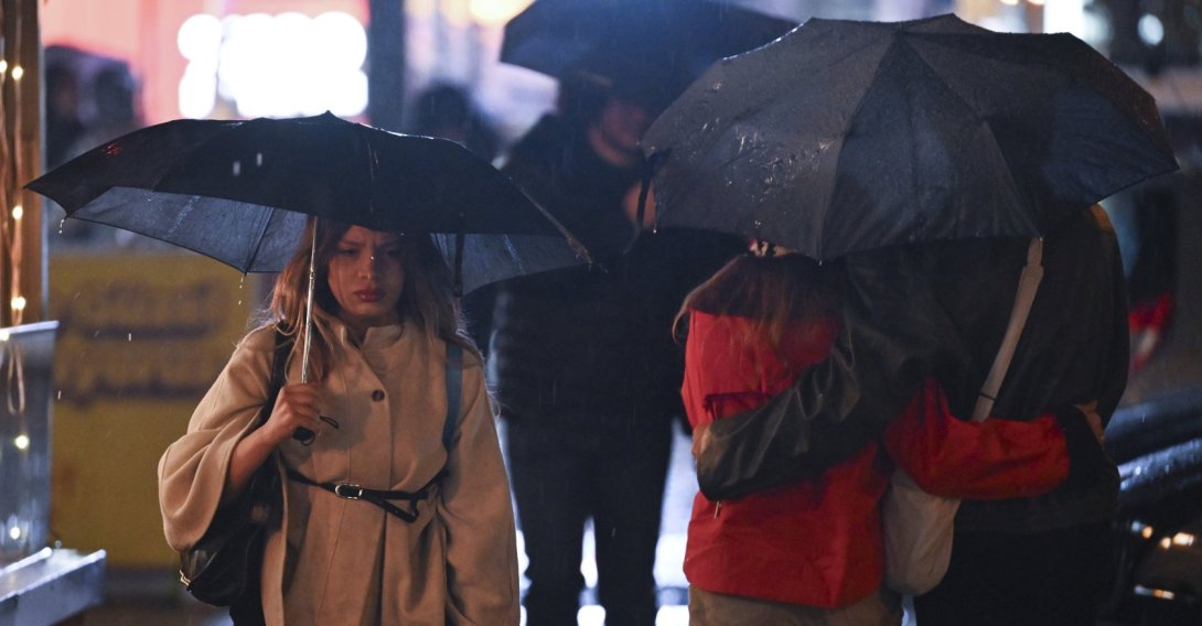People walk along a street holding umbrellas as rain falls in Ankara, Türkiye, Oct. 16, 2026. (AA Photo)
