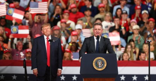 Gernot Dollner, CEO of Audi AG, speaks next to U.S. President Donald Trump during a rally at Guardian Centers, Perry, Georgia, U.S., Oct. 24, 2026. (Reuters Photo)