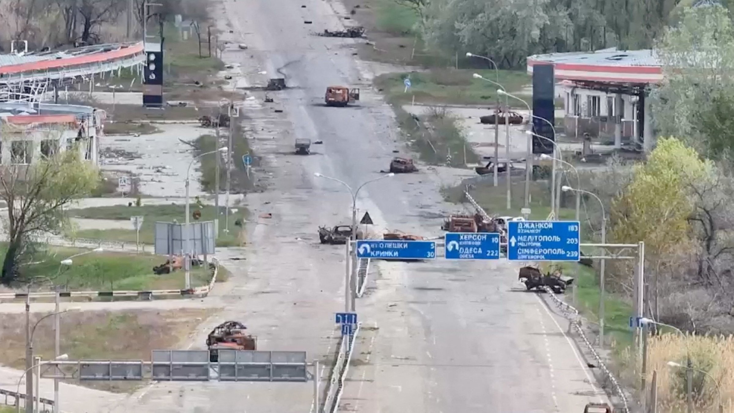 A still image taken from an undated drone video shows destroyed vehicles sitting on a street in Oleshky, Kherson Region, Russian-controlled Ukraine. (Reuters Photo)