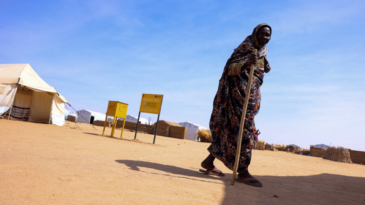 An elderly Sudanese refugee woman stands outside a health clinic run by the International Rescue Committee (IRC) at Iridimi refugee camp, northwest of Iriba, in Wadi Fira province, eastern Chad, Nov. 27, 2025. (Reuters Photo)