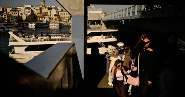 People are photographed crossing the bridge in the historic area of Istanbul, Türkiye, Oct. 11, 2026. (AA Photo)