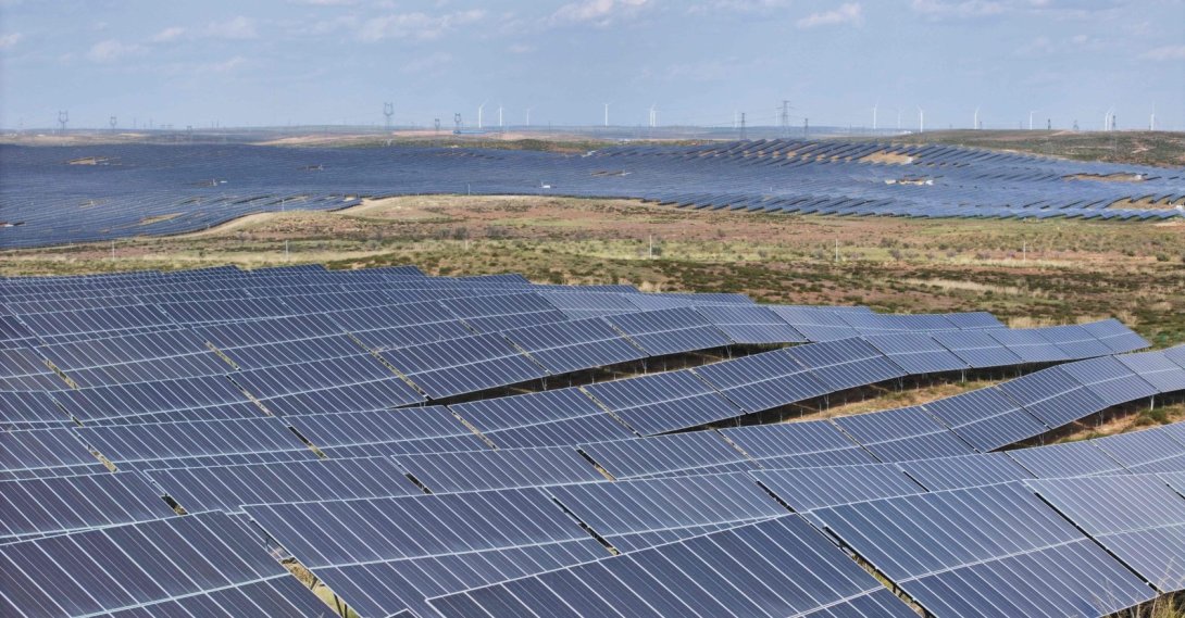 Wind turbines are seen behind solar panels at the Ningdong Energy and Chemical Base in Yinchuan in the northern Ningxia region, China, Sept. 28, 2026. (AFP Photo)