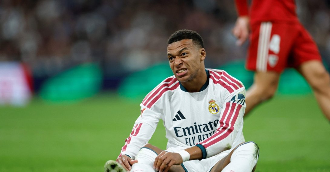Real Madrid's Kylian Mbappe reacts on the ground during the LaLiga match against Sevilla FC at the Santiago Bernabeu Stadium, Madrid, Oct. 18, 2026. (AFP Photo)