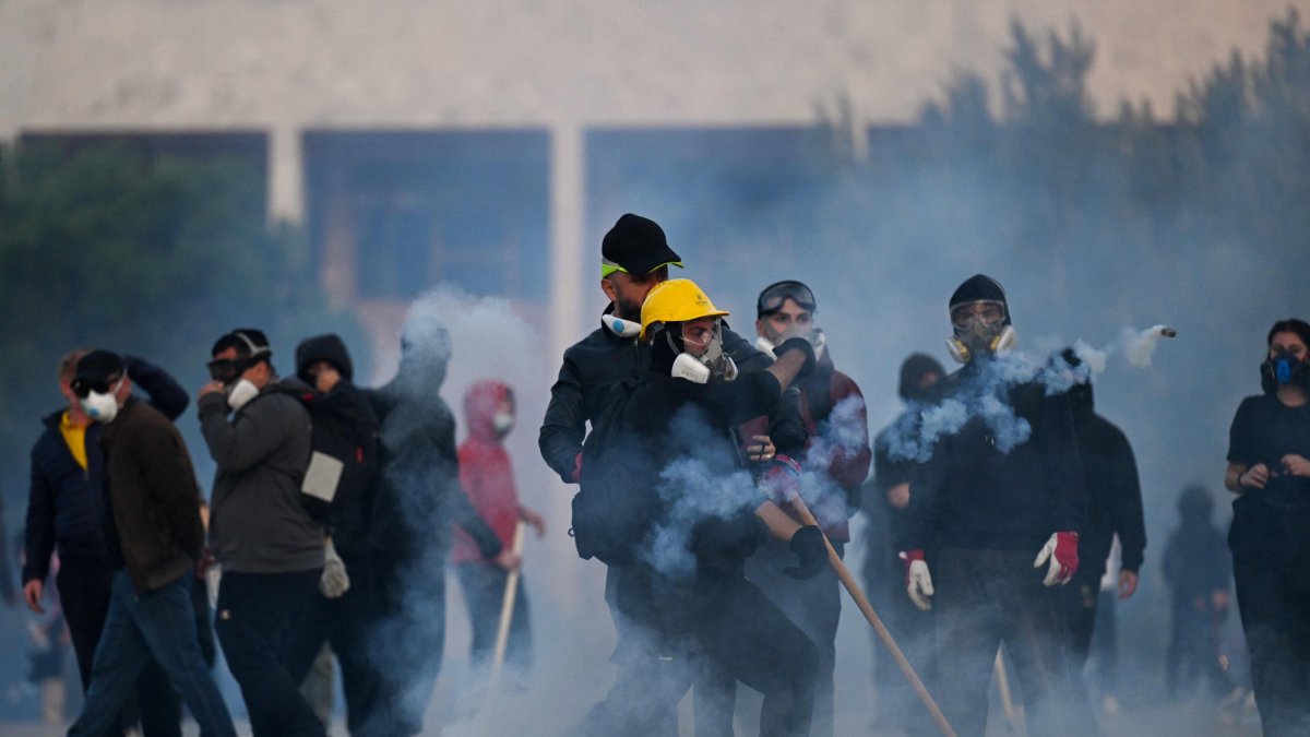 Protesters clash with riot police during a national anti-government demonstration, called by the student-led protest movement to demand better support for education and the prime minister's resignation, Tirana, Albania, Oct. 24, 2026. (AFP Photo)