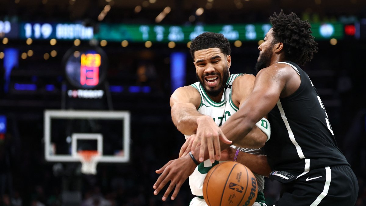 Brooklyn Nets' Chaney Johnson (R) and Boston Celtics' Jayson Tatum battle for control of the ball during the second half at TD Garden, Boston, U.S., Oct. 27, 2026. (AFP Photo)