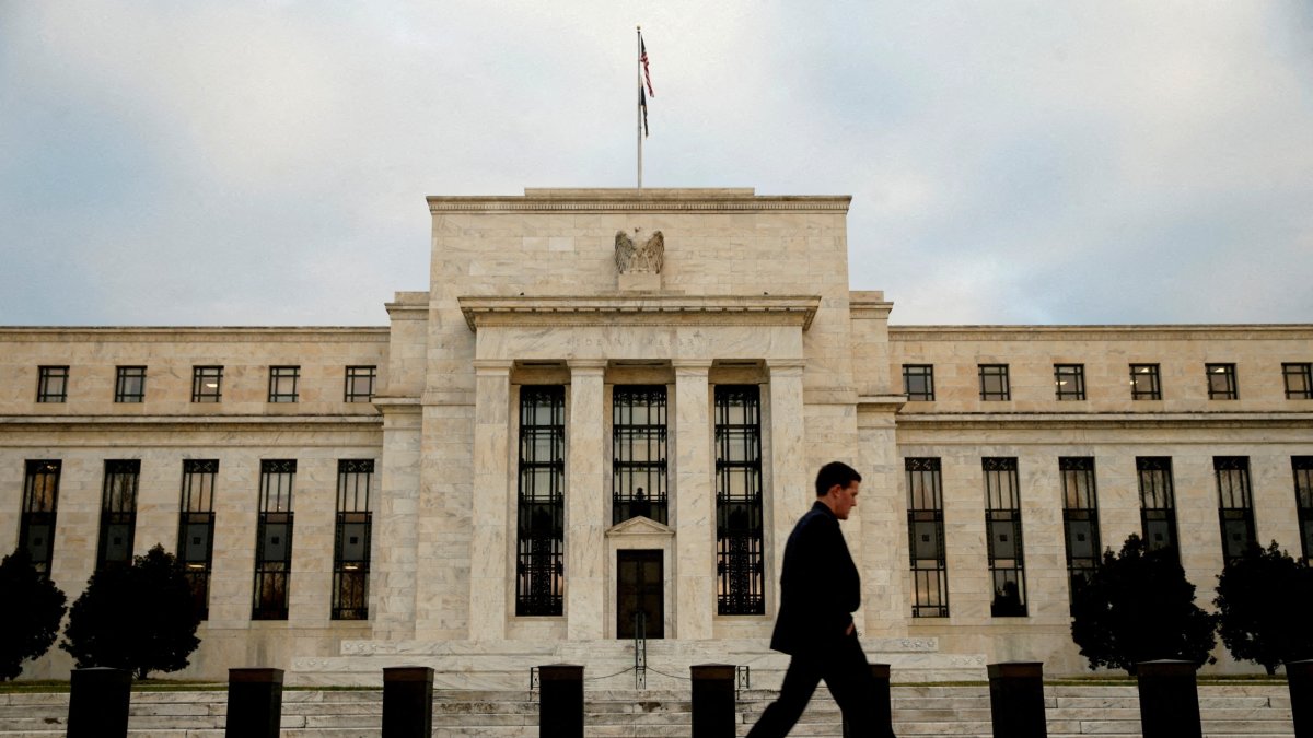 A man walks past the Federal Reserve in Washington, Dec. 16, 2015. (Reuters File Photo)