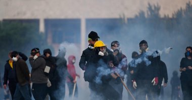 Protesters clash with riot police during a national anti-government demonstration, called by the student-led protest movement to demand better support for education and the prime minister's resignation, Tirana, Albania, Oct. 24, 2026. (AFP Photo)