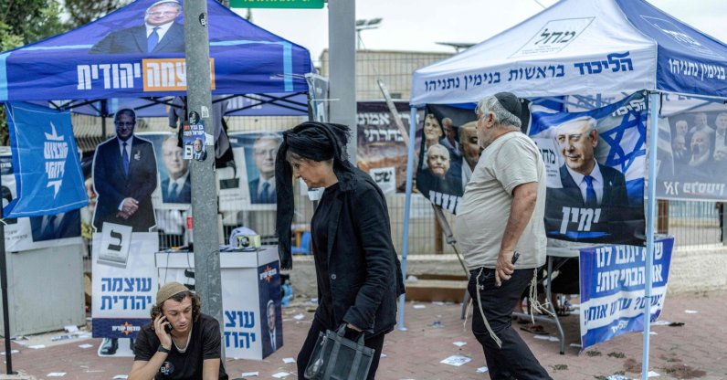 Religious Israelis walk outside a polling station during Israel's legislative election, Bet Shemesh, Israel, Oct. 27, 2026. (AFP Photo)