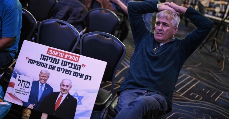 A supporter of the Likud party leader and Prime Minister Benjamin Netanyahu waits at the election night rally in Jerusalem, Oct. 28, 2026. (AFP Photo)