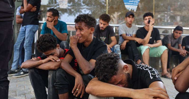 Mourners grieve during the funeral of three Palestinians at Al Shifa Hospital after they were killed in an Israeli strike on the Islamic University building, Gaza City, Palestine, Oct. 25, 2026. (AFP Photo)