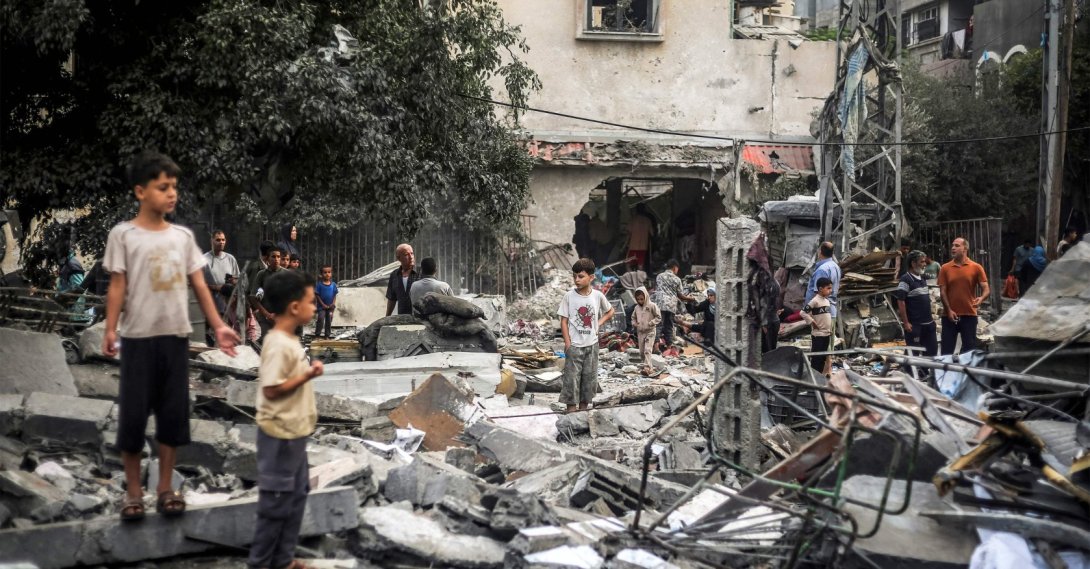 Children stand by the rubble of a destroyed building following an Israeli airstrike in Nuseirat in the central Gaza Strip, Oct. 23, 2026. (AFP Photo)