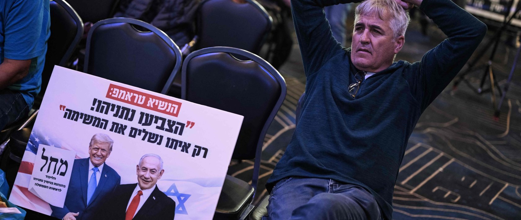 A supporter of the Likud party leader and Prime Minister Benjamin Netanyahu waits at the election night rally in Jerusalem, Oct. 28, 2026. (AFP Photo)