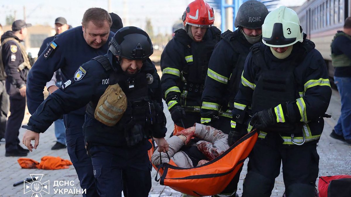 Ukrainian rescuers carry an injured person on a stretcher following a drone attack on the railway station in Dnipro, Ukraine, Oct. 29, 2026. (AFP Photo)