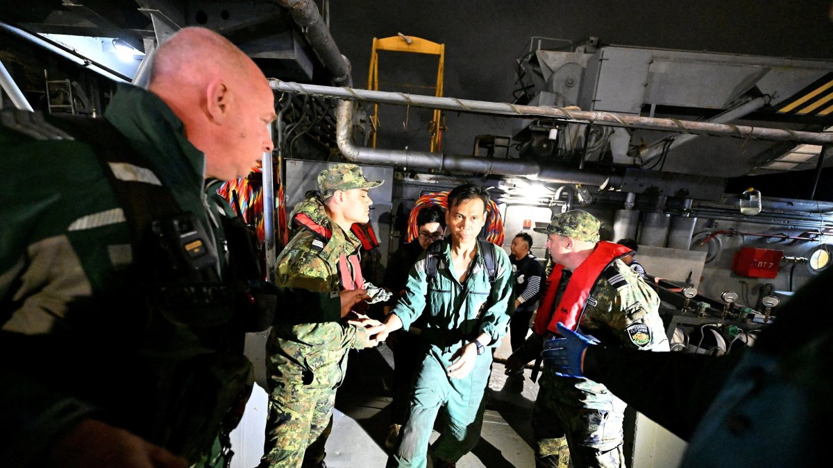 Crew members from a ship damaged in a drone attack disembark from a Bulgarian border police vessel in Varna, Bulgaria, following a rescue operation after sea drones struck a container ship off Bulgaria's Black Sea coast, Oct. 28, 2026. (Reuters Photo)