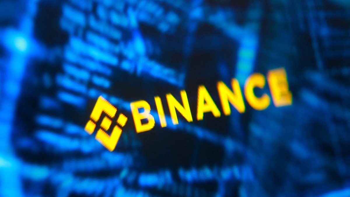 Binance logo and hacker code are seen in this illustration taken Oct. 30, 2026. (Reuters Photo)