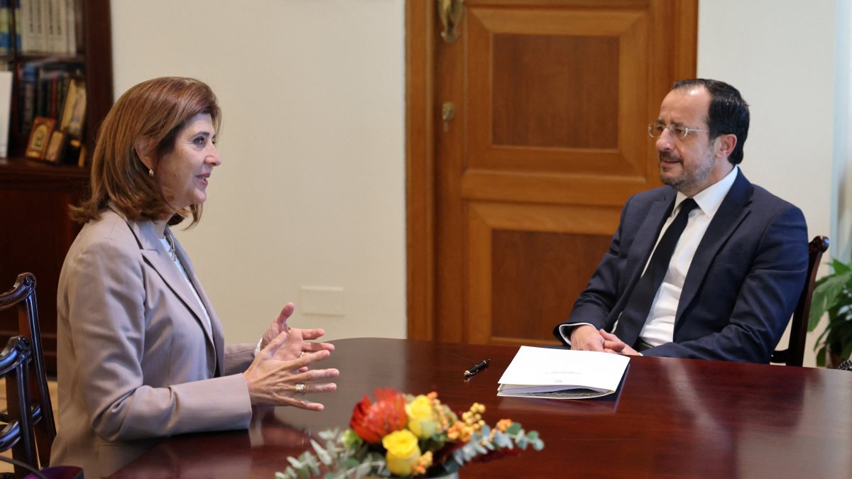 Greek Cypriot leader Nikos Christodoulides and U.N. Secretary-General's Personal Envoy on Cyprus Maria Angela Holguin talk during a meeting, Lefkoşa (Nicosia), island of Cyprus, Oct. 30, 2026. (Reuters Photo)