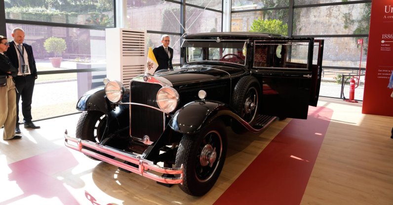 A popemobile used by successive popes is displayed at "A Century of the Popemobile," an exhibition tracing 100 years of papal transportation, from Pope Pius XI's first automobile in 1930 to modern popemobiles, at the Vatican Museums, Vatican, Oct. 28, 2026. (AP Photo)