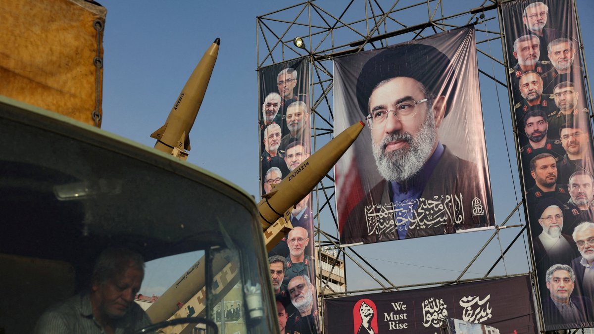 Iranian missiles are displayed next to a banner with a picture of Iran's Supreme Leader, Mojtaba Khamenei, Tehran, Iran, Sept. 27, 2026. (Reuters Photo)