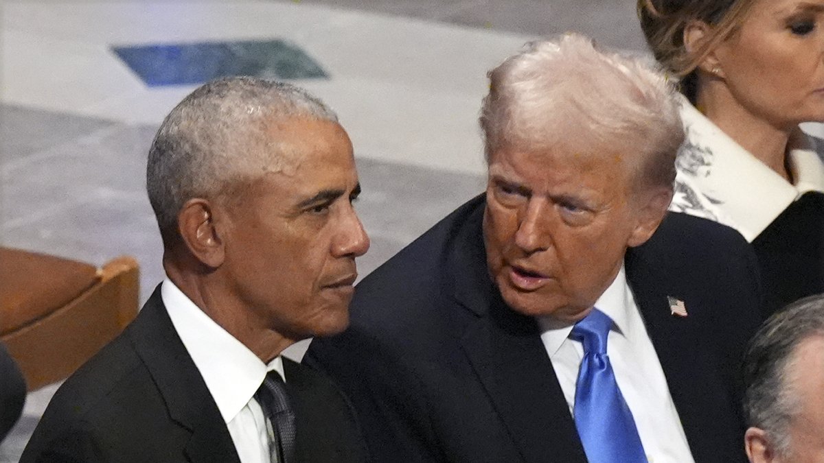 Barack Obama talks with Donald Trump before the state funeral for former President Jimmy Carter at Washington National Cathedral in Washington, U.S., Jan. 9, 2025. (AP Photo)