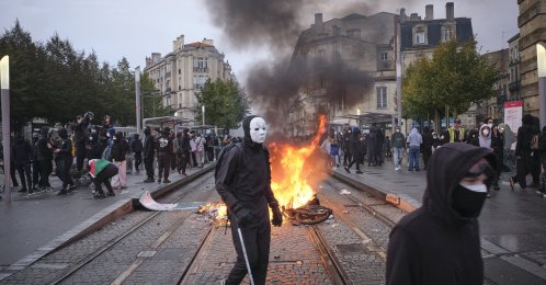 People protest as objects burn at a barricade during a demonstration against the high cost of living, Bordeaux, France, Oct. 24, 2026. (EPA Photo)